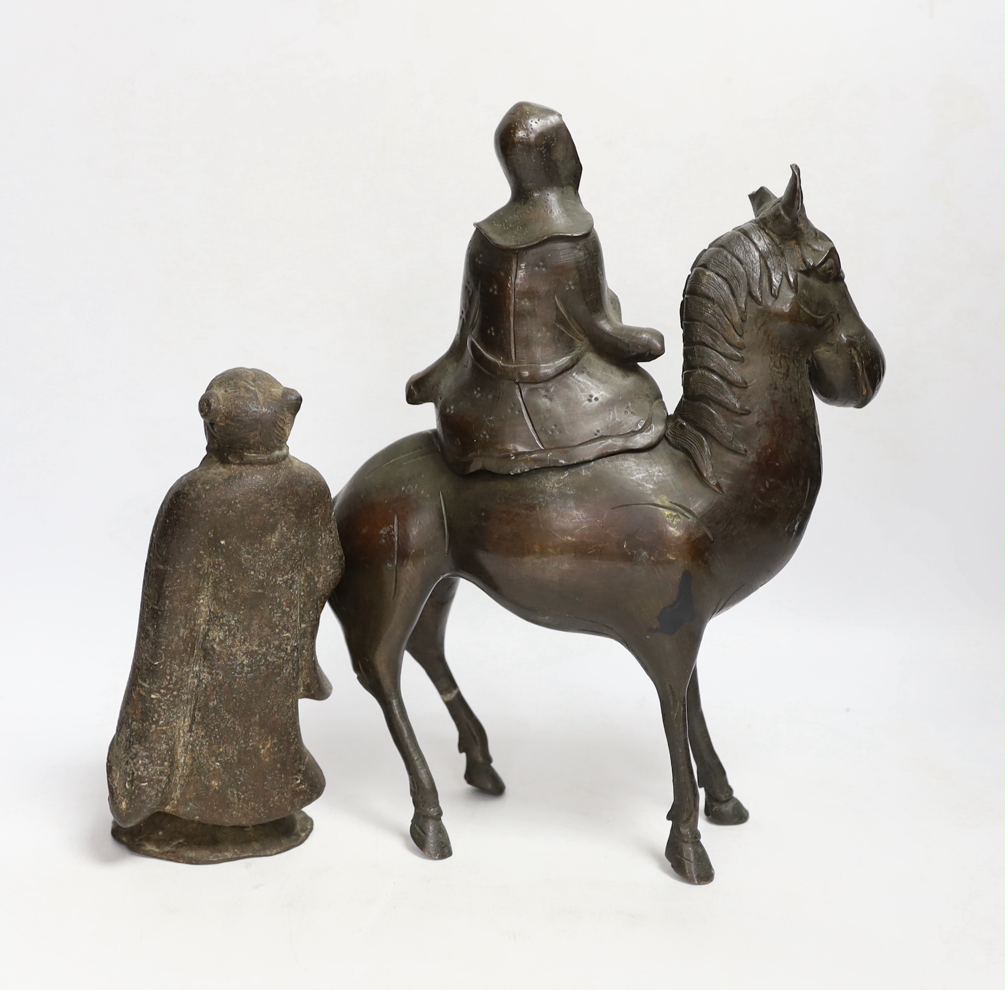 Two Chinese bronze figures; a luohan on his mule and a figure of a wise man, tallest 30cm